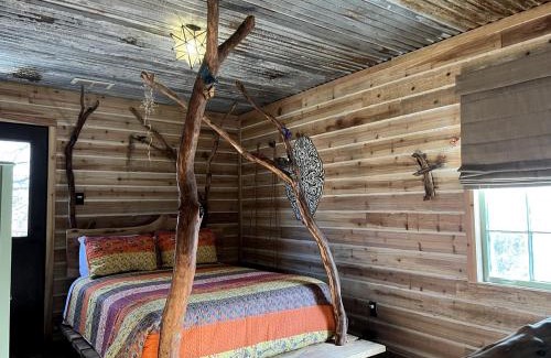 Dennis Maison | Magical Treehouse with Slide by Brazos River for Family Glamping Adventures in Texas