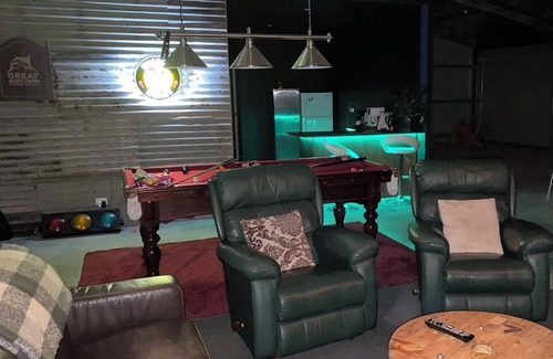 Mount Doran Maison | Man Cave with a touch of Lux. and an open fire.