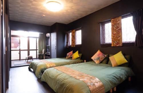 Maejima Maison | Maximum of 21 people can be rented in one building 3 minutes walk to Tomari Port 10 minutes drive to the airport No parking lot 30 seconds walk from paid parking lot warayunso port city May