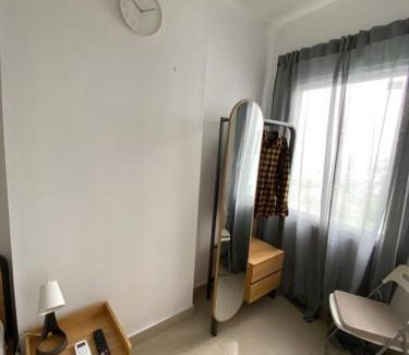 Tangerang Appartement | Minimalist room at The Nest Apartment by Popobella Near Puri Indah West Jakarta