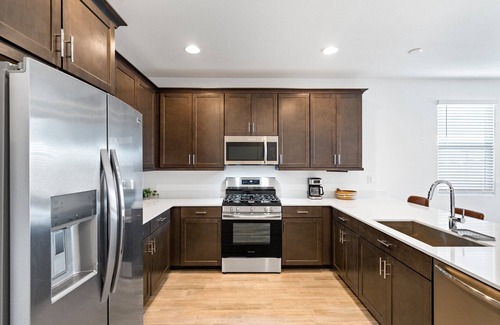 Goodyear Maison | Modern 3BR/2BA home in Goodyear with a community pool, pickleball courts, and EV charger! Less than a mile from Goodyear baseball stadium and close to other major venues, shopping, and golf courses!