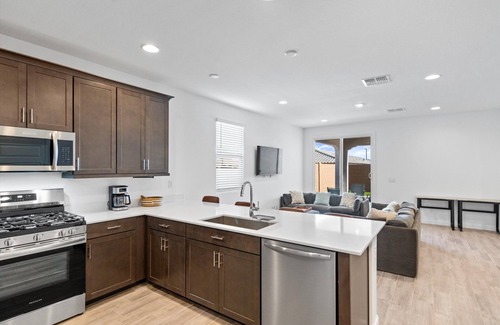 Goodyear Maison | Modern 3BR/2BA home in Goodyear with a community pool, pickleball courts, and EV charger! Less than a mile from Goodyear baseball stadium and close to other major venues, shopping, and golf courses!