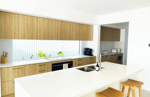 Pelican Waters Maison | Modern Boho Retreat with Pool, Yard & Beaches Just Minutes Away