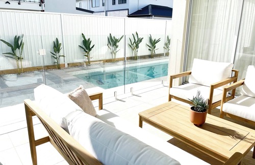 Pelican Waters Maison | Modern Boho Retreat with Pool, Yard & Beaches Just Minutes Away