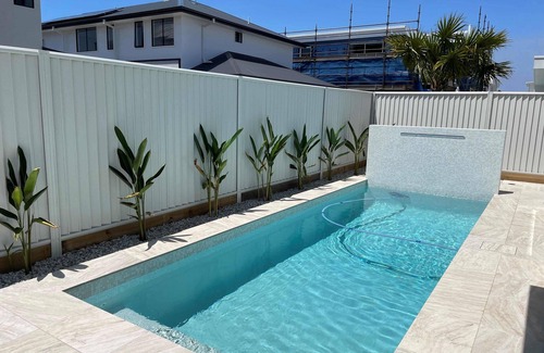 Pelican Waters Maison | Modern Boho Retreat with Pool, Yard & Beaches Just Minutes Away