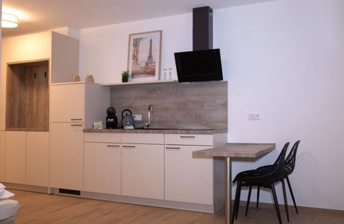 Jollenbeck Copropriété | Modern cozy purple apartment