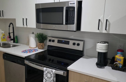 Regina Maison | Modern Family Suite with Free Parking, Near Malls, Parks & Transit