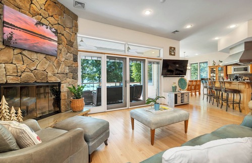 Laconia Maison | Modern Lake Opechee Home features Sandy Perched Beach and Dock