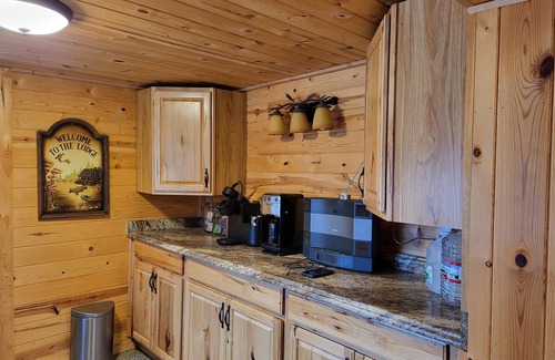 Pine Cabine | Fishing Cabin on the River behind the Railroad Tracks.