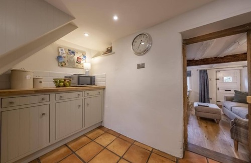 Stiffkey Cottage | Un chalet de caractère confortable avec de belles vues et de charmants jardins de chalets.