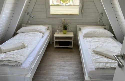 Carolinensiel Maison | Murmel 1 - Strandkorb, Wallbox, WLan, Kamin