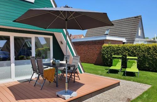 Carolinensiel Maison | Murmel 4 - Strandkorb, Wallbox, WLan, Kamin
