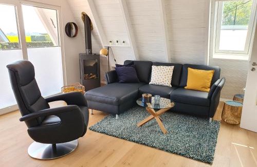 Carolinensiel Maison | Murmel 4 - Strandkorb, Wallbox, WLan, Kamin