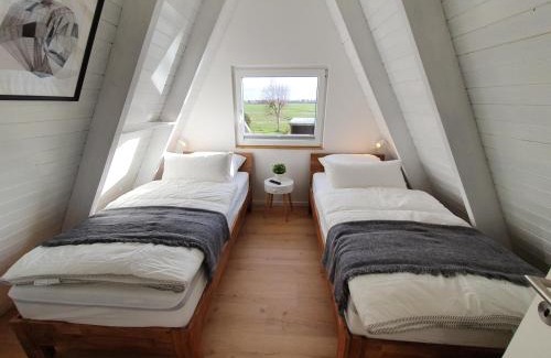 Carolinensiel Maison | Murmel 4 - Strandkorb, Wallbox, WLan, Kamin