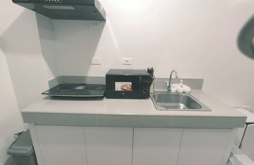 Novaliches Copropriété | Netflix+ Games+ Cooking+ Karaoke+ Wifi 1 BR Condo in Daily Relax Trees Residence