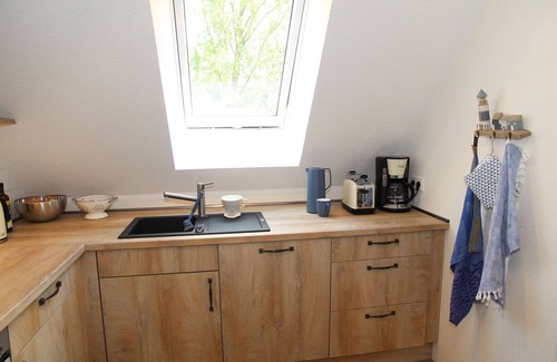 Eilsum Appartement | Neue 80qm Ferienwohnung für 4 Pers. + 2 Hunde mit Kamin, Balkon & Wasserblick