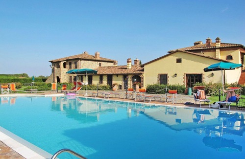Rigutini Appartement | Joli appartement avec climatisation, WIFI, piscine, TV, patio, animaux admis et parking