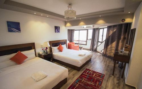 Al Duqqi Hôtel | Nile Guardian Hotel