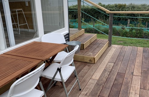 Cape Palliser Maison | Ocean views of the Kaikoura's and surf break. Private beach hut.