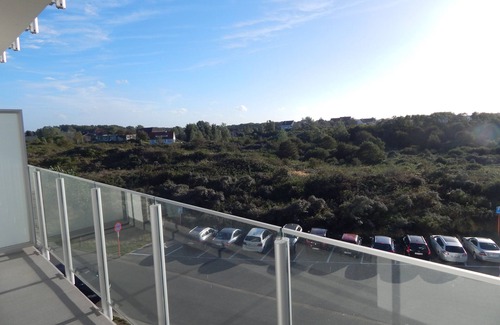 Oostduinkerke-Bad Appartement | Face aux dunes, lumineux, calme, près de la plage et des commerces, garage privé