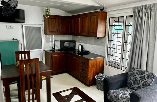 Kochchikade Appartement | Palmwood Cottages Double Bed Room with Kitchen