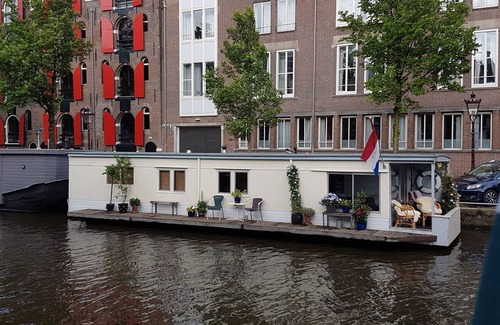 Grachtengordel-West Location De Bateaux | Pantheos Houseboat à Prinsengracht avec une vue sur le Westerkerk le Landmark.