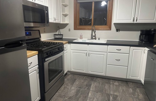 Walloon Lake Cabine | Peaceful cabin hideaway with fire pit & hot tub only 3 blocks from Walloon Lake