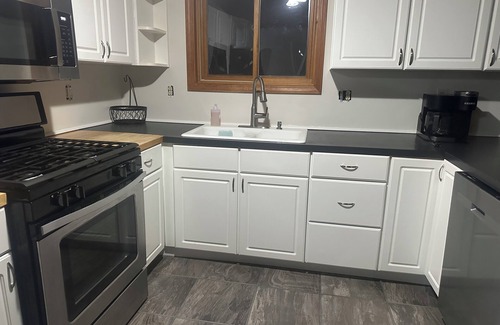 Walloon Lake Cabine | Peaceful cabin hideaway with fire pit & hot tub only 3 blocks from Walloon Lake