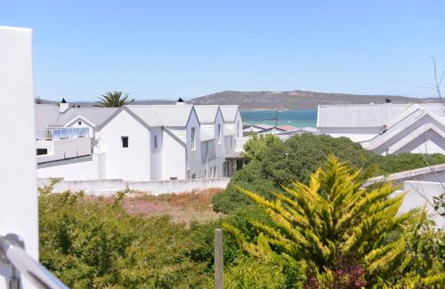 Langebaan Maison | Pelican Cove is a Modern 4-Bedroom Holiday Home in Langebaan with some Sea Views