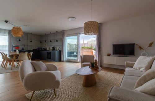 Ehmen Appartement | Penthouse-Ferienwohnung Wolfsburg mit Dachterrasse WLAN Smart-TV überdachter Parkplatz Wallbox