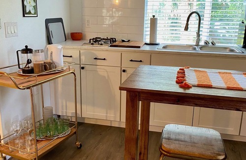 Eustis Cottage | Pine Forest Studio, serene winding lane to cozy retreat.