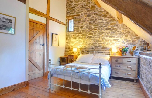 Llanwrda Maison | Conversion de grange du 17ème siècle conservant une grande partie de son caractère original. Espace de vie ouvert avec l