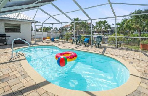 Bal Harbour Maison | Pirates Den a 4BR Pet-Friendly Waterfront Oasis with Pool, Dock, Personal Water Boats, Fire Pit, Game Room and Bar