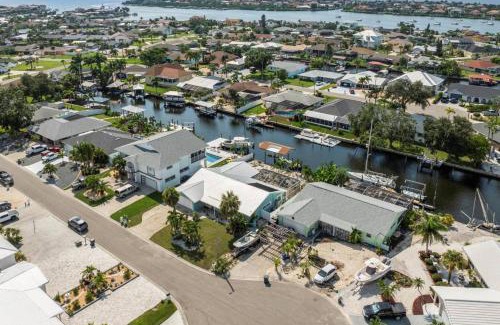 Bal Harbour Maison | Pirates Den a 4BR Pet-Friendly Waterfront Oasis with Pool, Dock, Personal Water Boats, Fire Pit, Game Room and Bar