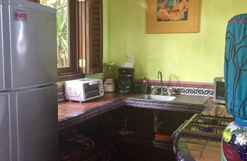 Los Ayala Appartement | Playa Suite: Suite en bord de mer avec patio privé au milieu de jardins tropicaux