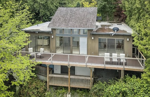 Gig Harbor Maison | Pacific NW Mid-Century Modern Waterfront Gem Located on Raft Island with Hot Tub by RedAwning