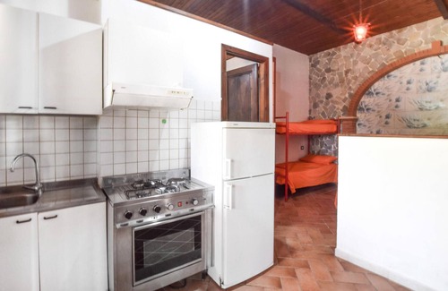 Praia a Mare Appartement | Practical apartment with open terrace and communal pool.
