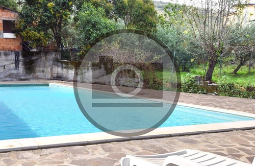 Praia a Mare Appartement | Practical apartment with open terrace and communal pool.