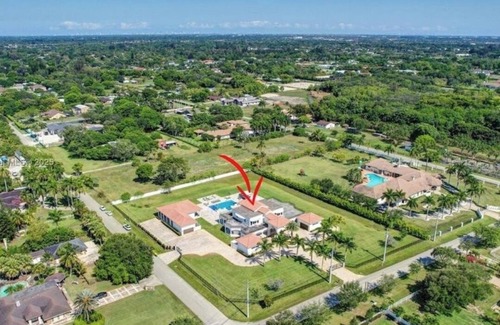 Southwest Ranches Maison | Private, gated 8-bedroom oasis with 6 car garage in prestigous Southwest Ranches