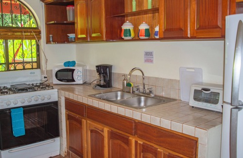 Dominical Appartement | Private suite 102 with beautiful gardens, shared pool and BBQ area!