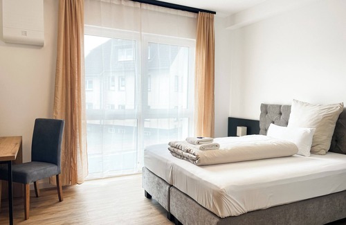 Detmold Hôtel | Qonroom - Detmold - shared kitchen - BBQ - App2