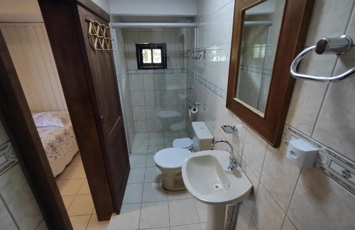 Praia Grande Appartement | Quarto Ipê Rosa