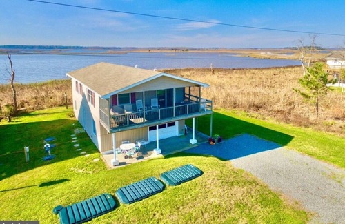 Prime Hook Beach Maison | Quiet dog friendly home overlooking nature preserve, 1 block from private beach.
