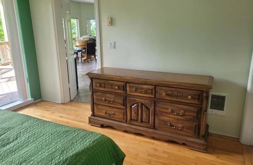 Powell River Maison | rainforest suite with a king size bed