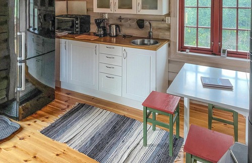 Nordre Land Maison | Recharge your batteries in this cozy log cabin near the Synna River.