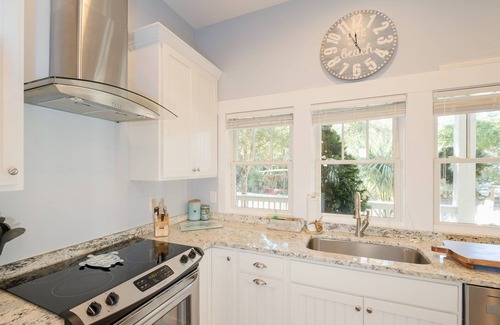 Cape Fear Station Maison | Reel Life tucked into a pretty, wooded bend in prestigious Cape Fear Station!