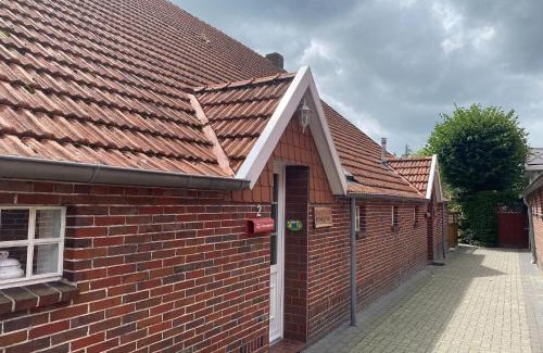 Strackholt Appartement | Reihenhaus in Strackholt mit beheiztem Pool