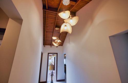 Gibson Bight Maison | Relax At This Hillside Retreat That Overlooks The Lush Forest And The Caribbean,