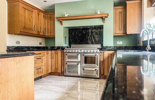 Margam Cottage | Relax in the hot tub and unwind in the peaceful, private garden.