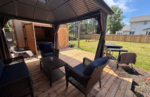 Summerside Maison | Relax with an enclosed hot tub and cozy island vibes in the heart of Summerside